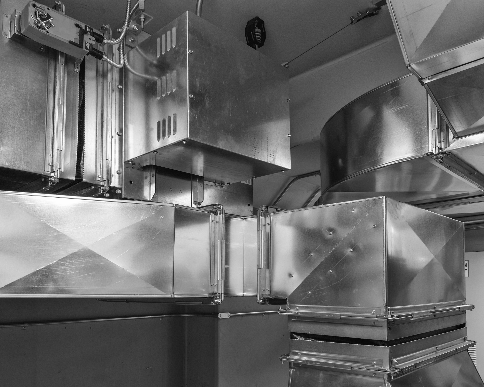 Ductwork with damper actuator controls air flow into an air conditioned space